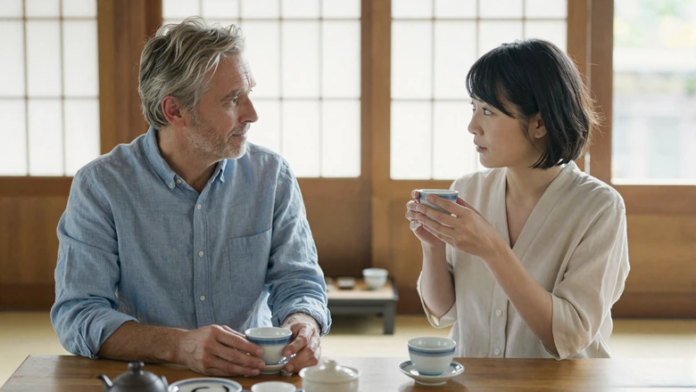 American man and Japanese woman sharing tea during a cross-cultural date